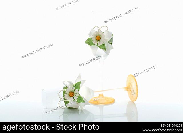 Wedding champagne glasses decorated with lace and flowers