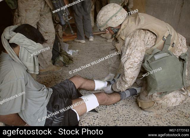 IRAQ Fallujah -- 13 Nov 2004 -- Hospital Corpsman Lucas Jushinski of Seattle, Wash. , assigned to Company B, 1st Battalion 8th Marine Regiment