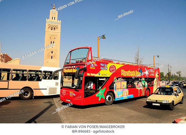 Double-decker open-top tourist bus in front of the Koutoubia Mosque, Marrakech, Morocco, Africa