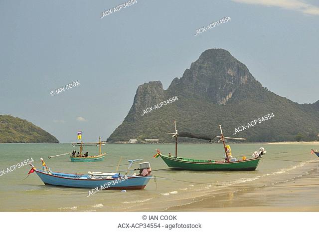 beached fishing boats in Prachuap Kiri Khan Harbour, Gulf of Thailand, Thailand