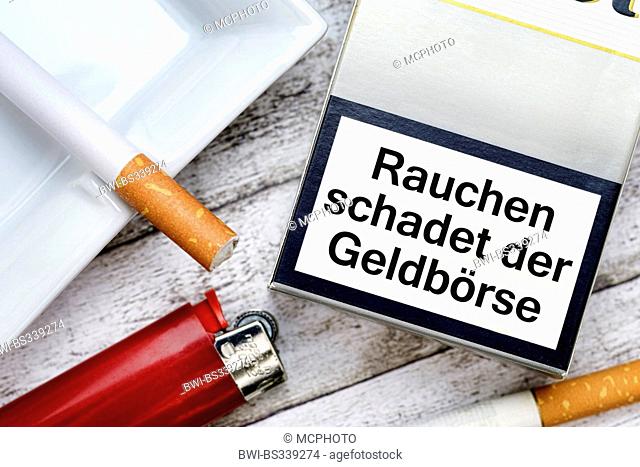 cigarette packet with the inscription 'Rauchen macht arm' ('Smoking harms your purse'), symbol photo criticising a high tobacco tax