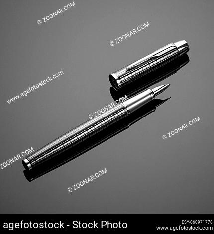 fashionable ink pen on a black background