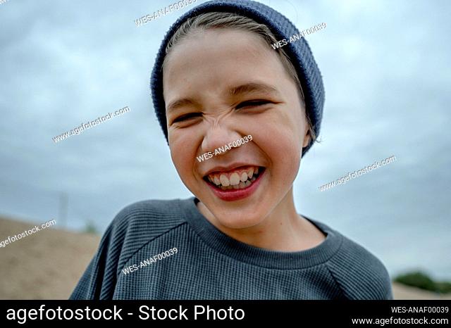 Smiling boy wearing knit hat