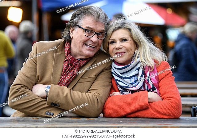 22 February 2019, Bavaria, München: Marianne and Michael Hartl, singing duo of folk music, sit together on the Viktualienmarkt before an interview with the...