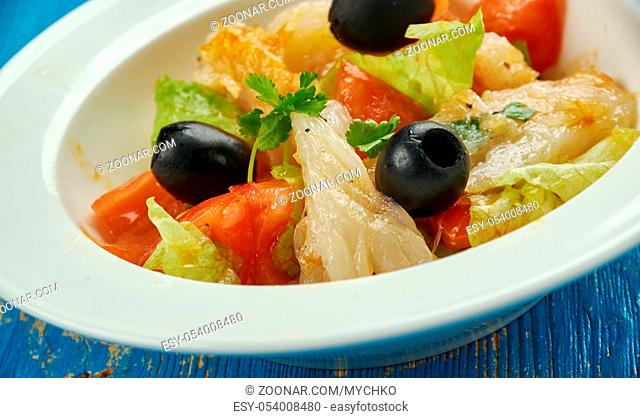 Esqueixada - traditional Catalan dish, a salad of shredded salt cod, tomatoes, onions, olive oil and vinegar, salt