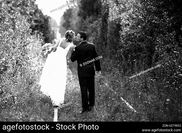 Romantic wedding Couple kissing outdoors