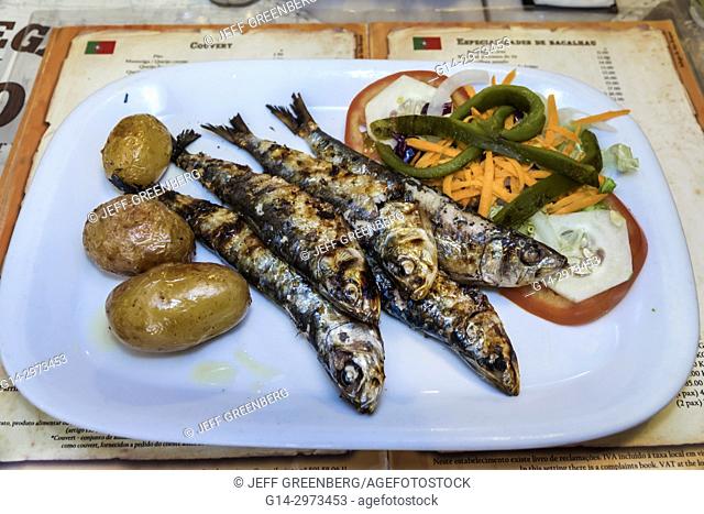 Portugal, Lisbon, Bairro Alto, Restaurante Adega de Sao Roque, restaurant, dining, seafood, plate, sardines, potatoes, salad, typical Portuguese food