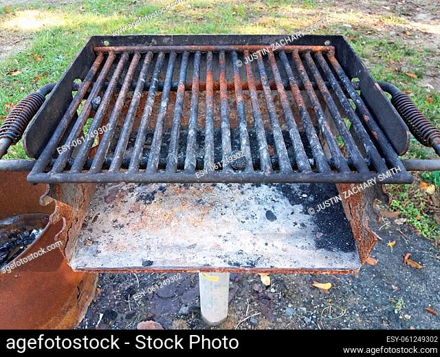 dirty rusty barbecue grill metal with coal ash