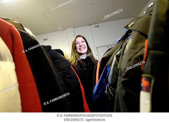 STOCKHOLM, SWEDEN Volunteer in a center for newly arrived refugees (a converted hotel) gets ready to distribute donated clothese