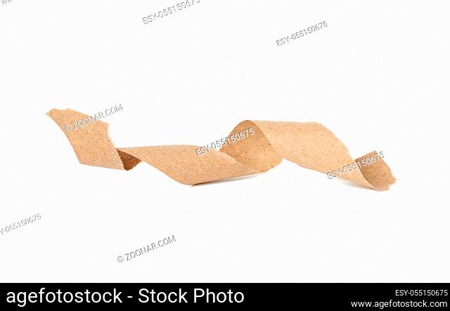twisted strip of brown craft paper isolated on white background, close up