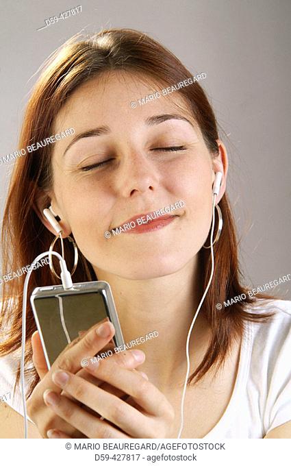 Young woman, 25, listening to her Ipod