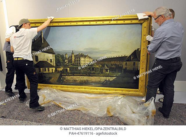 Specialists prepare the painting 'The Fortress of Konigstein: Courtyard with the Magdalenenburg' by Bernardo Bellotto also known as Canaletto