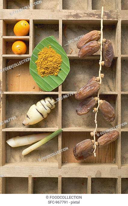 Exotic fruit, vegetables and spices in type case