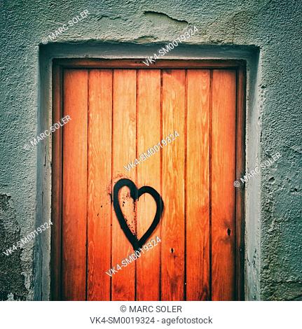 Drawn heart on a wooden door