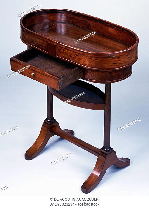 Directoire style mahogany work table with basket shaped top. France, late 18th-early 19th century. Three-quarter view.  Private Collection