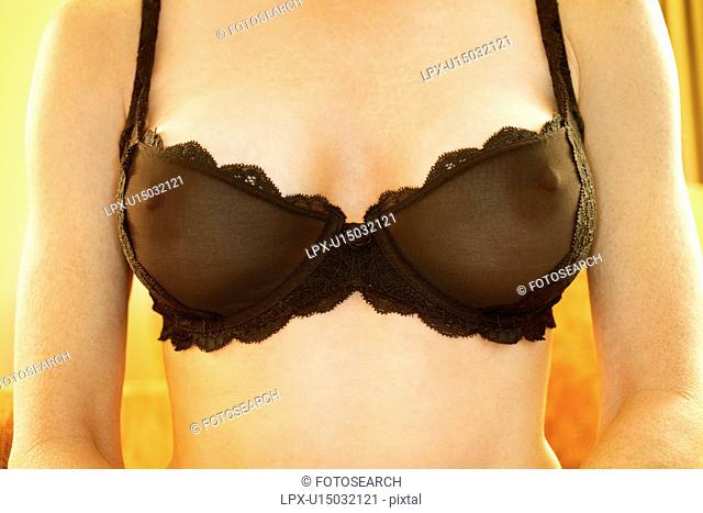 Close up of Caucasian woman wearing sheer black bra