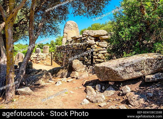 Arzachena, Sardinia / Italy - 2019/07/19: Archeological ruins of Nuragic necropolis Giants Tomb of Coddu Vecchiu - Tomba di Giganti Coddu Vecchiu - with...