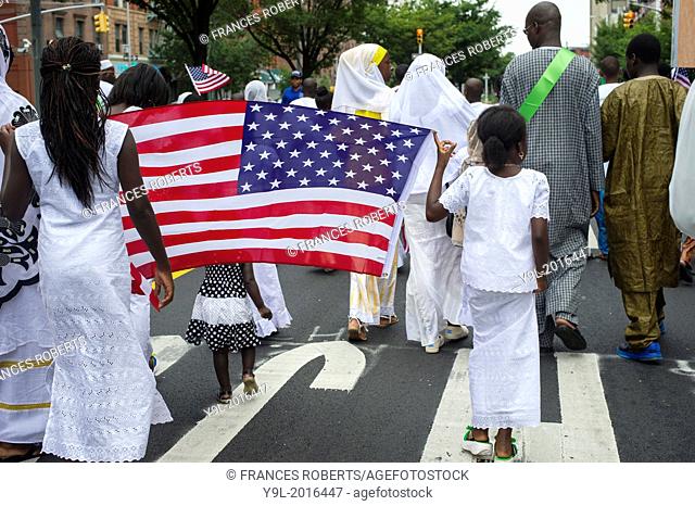 Sengalese immigrants participate in a parade in Harlem in New York commemorating their Shaykh Ahmadou Bamba during the Murid Islamic Community in America MICA...