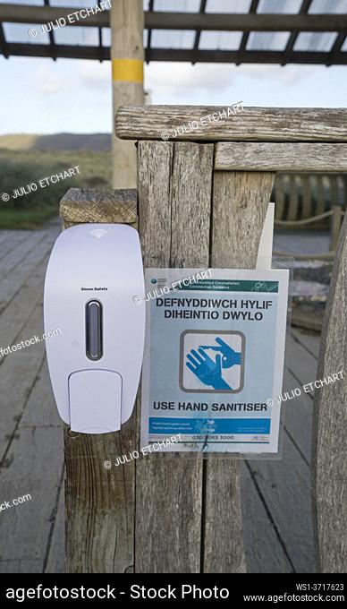 Bilingual Welsh-English sign warnings due to Coronavirus, Covid-19 pandemic near the beach in Ynyslas at the Dyfi estuary, near Borth and Aberystwyth