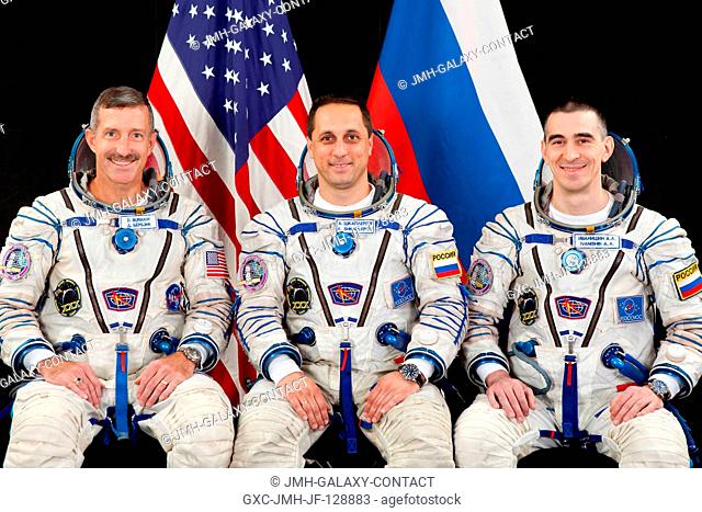 Attired in Russian Sokol launch and entry suits, NASA astronaut Dan Burbank (left), Expedition 29 flight engineer and Expedition 30 commander; along with...