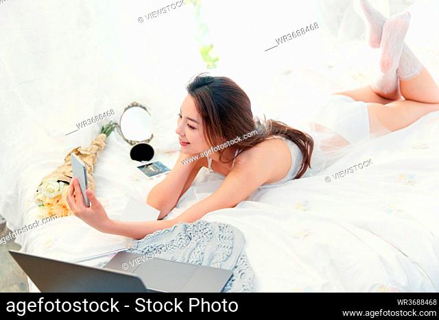 Lying on the bed take beautiful young women