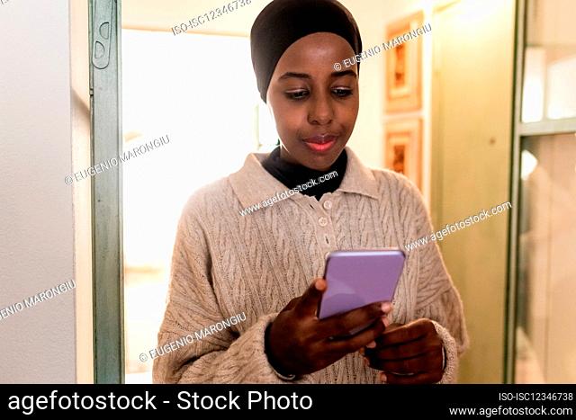 Young woman looking at her phone