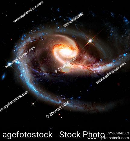 Spiral nebula and light ray in deep space. Elements of this image furnished by NASA