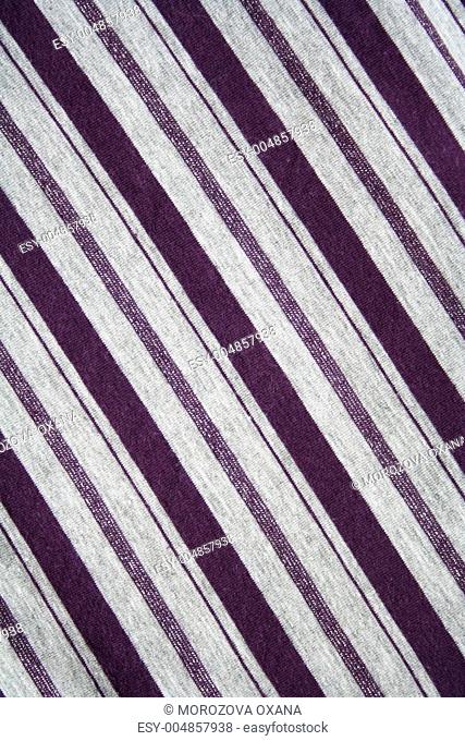 Grey and lilac strips on the fabric as background