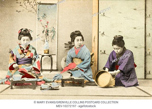 Three Geisha Girls eating a meal. The firl on the right is serving rice