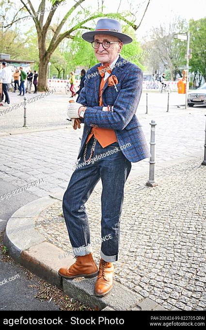 16 April 2020, Berlin: Male model and hipster grandpa Günther Anton Krabbenhöft is standing at the Admiralbrücke in Kreuzberg