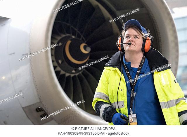 08 March 2018, Germany, Frankfurt: Sabrina Boock, responsible for aircraft handling, checking the airoworthiness of the Lufthansa Airbus A 321 before its flight...