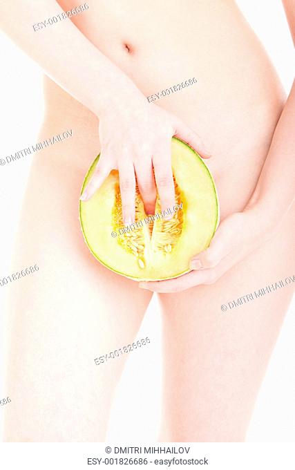 Young woman with half a melon