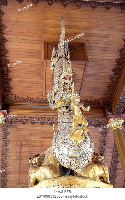 Details of the top of the Singu Min Bell at the Shwedagon Pagoda, a gilded stupa located in Yangon, Myanmar. It was donated in 1799 by King Singu