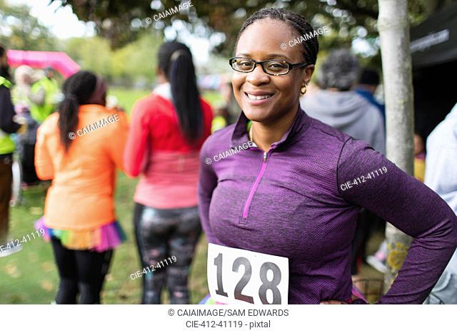 Portrait smiling, confident female runner at charity run