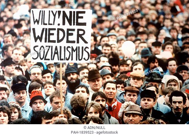 Spectators hold a banner reading 'Willy! No more Socialism!' as German Social Democrats (SPD) honourary chairman Willy Brandt delivers a speech during the...