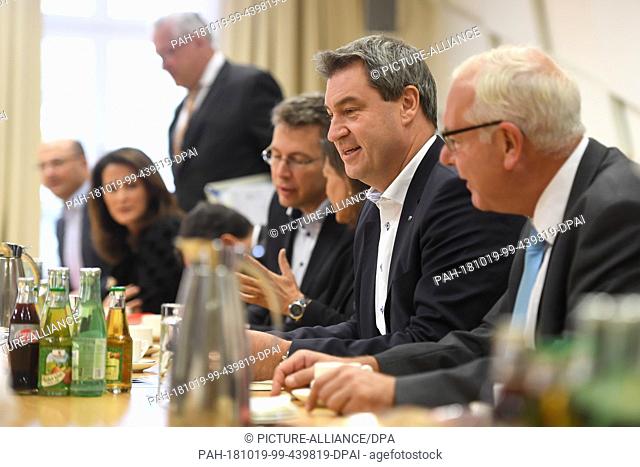 19 October 2018, Bavaria, Munich: Thomas Kreuzer (all CSU, r-l), leader of the CSU parliamentary group in the Bavarian state parliament, Markus Söder