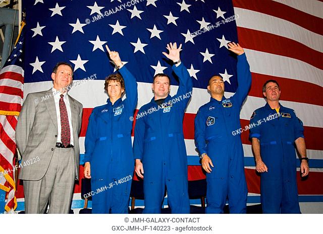 The STS-114 crewmembers wave to a crowd on hand at Ellington Field?s Hangar 276 near Johnson Space Center (JSC) during the crew return ceremonies