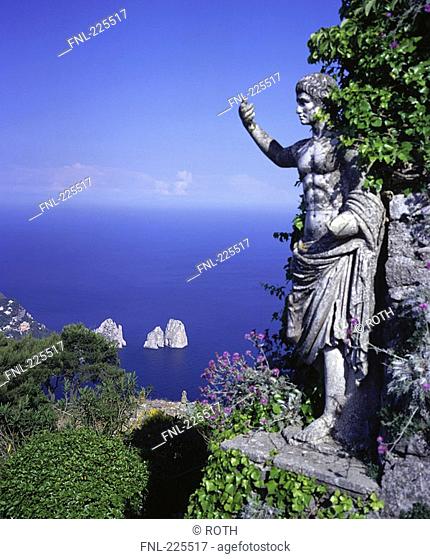 Sculpture of Augustus Caesar overlooking sea, Faraglioni Rocks, Capri, Italy
