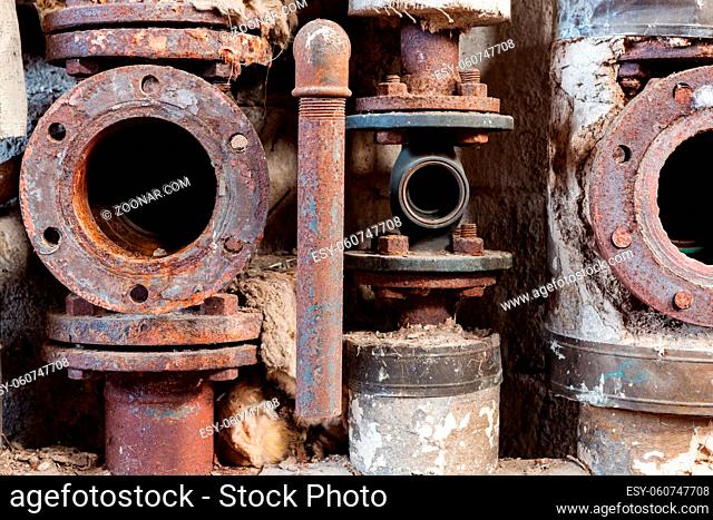 Rusty pipes close-up in old abandoned factory