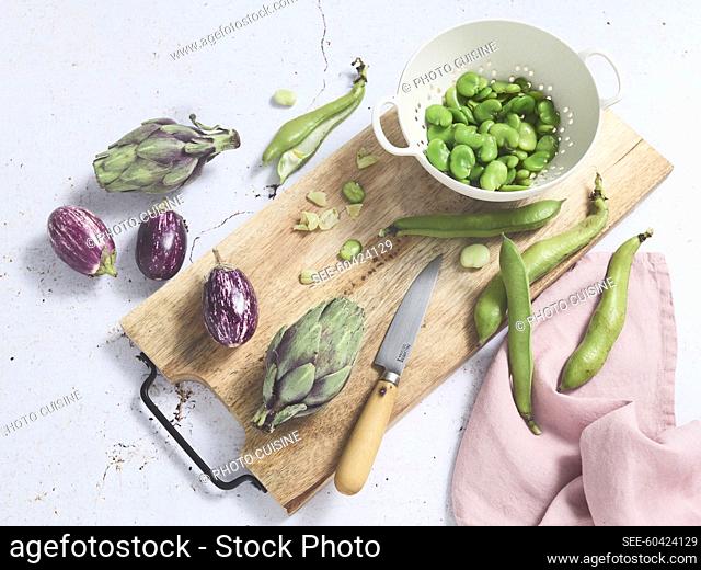 Podding fresh broad beans, small artichokes and mini aubergines