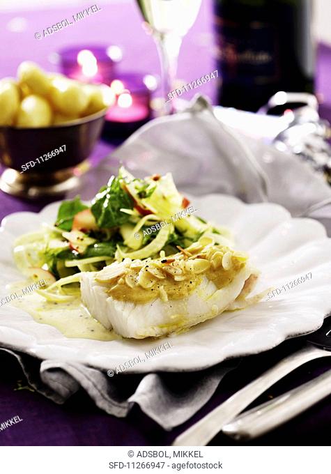 Cod fillet with a mustard and almond sauce served with an apple and fennel salad