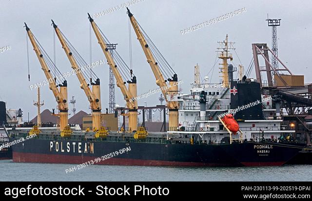 PRODUCTION - 12 January 2023, Mecklenburg-Western Pomerania, Rostock: The freighter ""Podhale"" is handled at the grain terminal in the seaport on the Baltic...