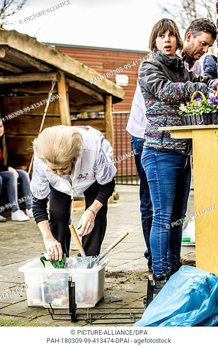 Princess Beatrix of The Netherlands during the annual volunteer day NL Doet at children day care 'Onder een Dak' for children with a handicap in Amersfoort