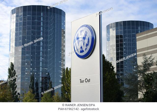 The corporate logo of German car manufacturer Volkswagen AG pictured in front of the storage towers of Volkswagen's Autostadt (car city) in Wolfsburg, Germany