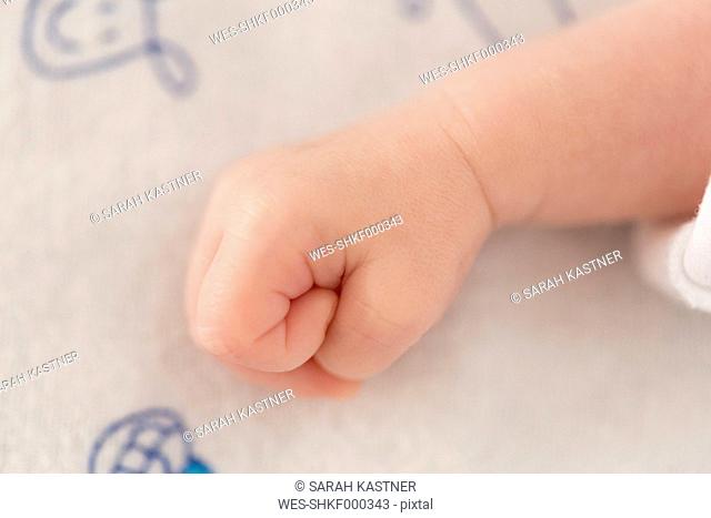 Fist of a newborn baby boy