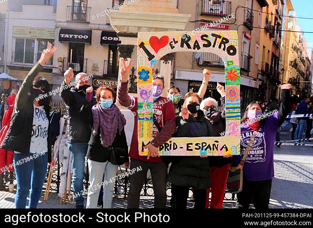 22 November 2020, Spain, Madrid: Traders demonstrate to keep the El Rastro flea market in Madrid open. The flea market was reopened after an eight-month...