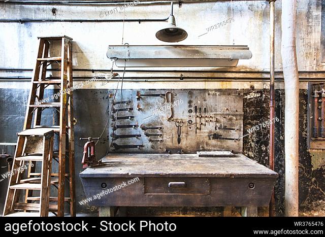 Work bench in historic vintage workshop with old fashioned fixtures