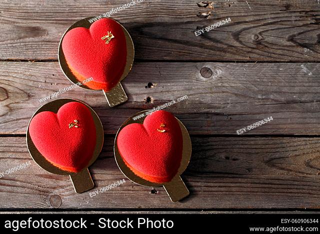 Red heart cacke desserts on wooden background. dessert for breakfast on Valentine's Day