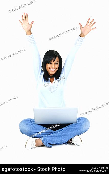 Happy woman with computer rasing arms