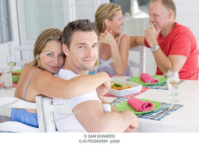 Couples eating breakfast together